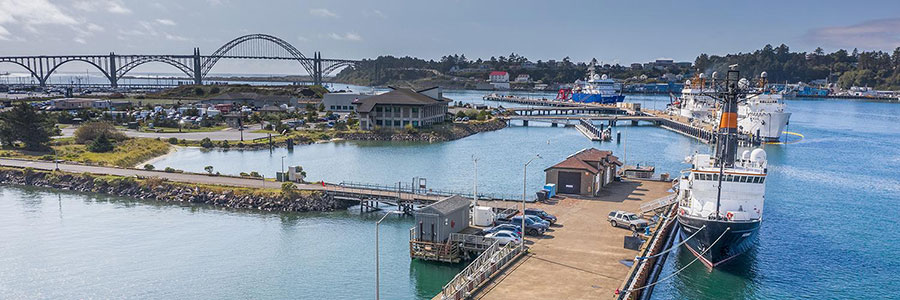 view of Newport Harbor that includes HMSC and a bridge