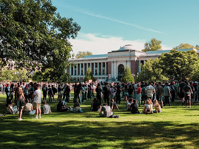 many groups of people in the Memorial Union quad on a sunny day